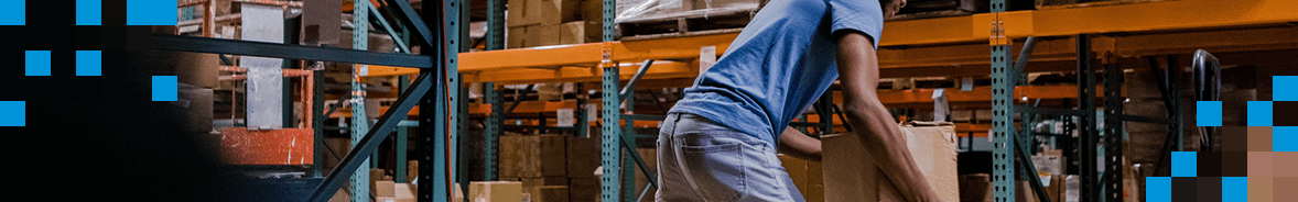 Man unloading boxes in a warehouse