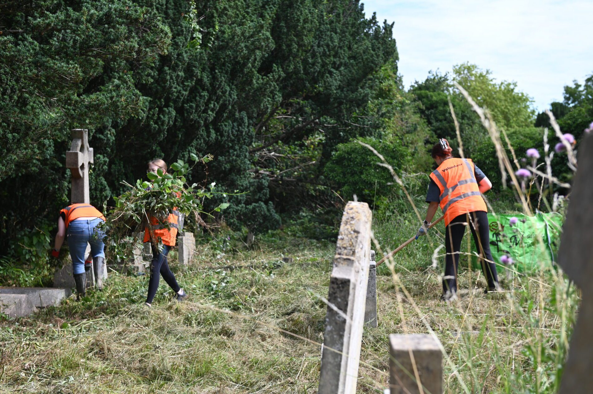 PEM volunteer with Cambridge city council in clearing graveyard ground from weeds and brambles 