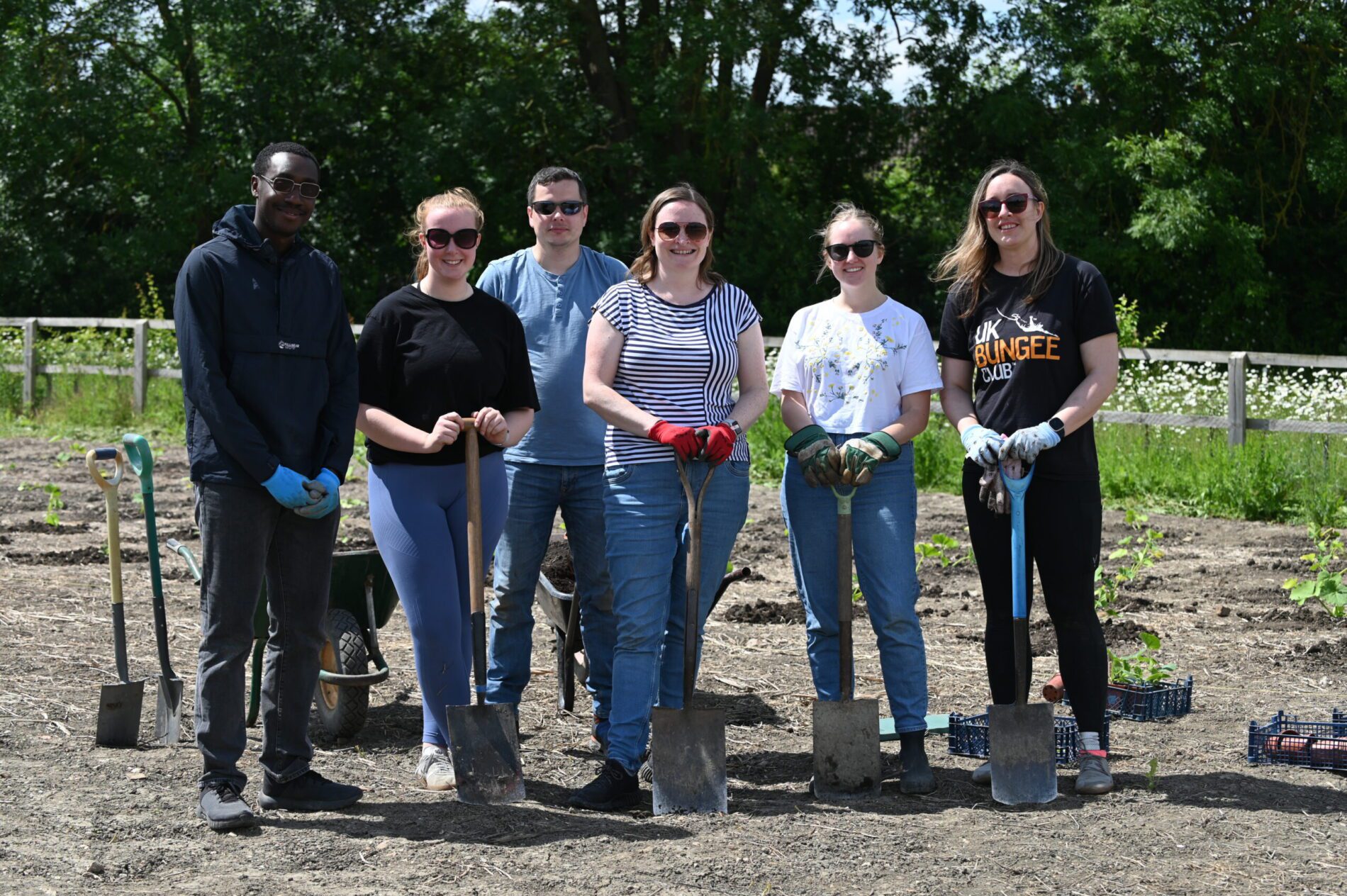 PEM team with spades help Cambridge Co Farm project plant pumpkins