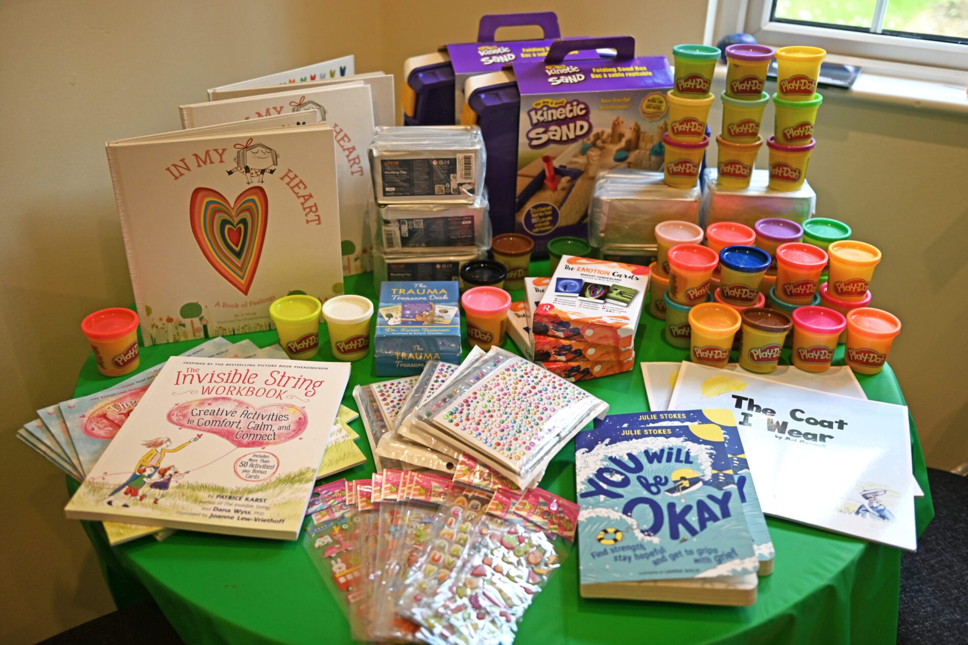 Toys, books, play-doh and clay donated by the PEM Charitable Trust to charity Ormiston Families