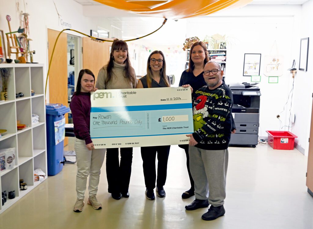 PEM charitable trust donation cheque presentation with team and students from Cambridge charity Rowan