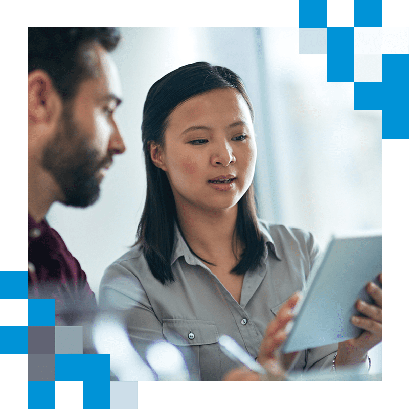 Woman and man in discussion using a tablet