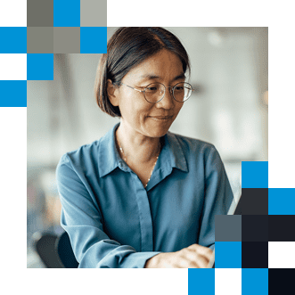 Woman in office using laptop
